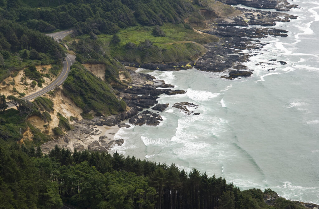 Stop at Cape Perpetua on your RV road trip to check out this view: High angle view of Highway 101 on the Oregon coast, seen from Cape Perpetua.
