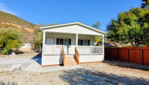 Manufactured Home with front porch in the Clear Creek Estates community in French Gulch, CA